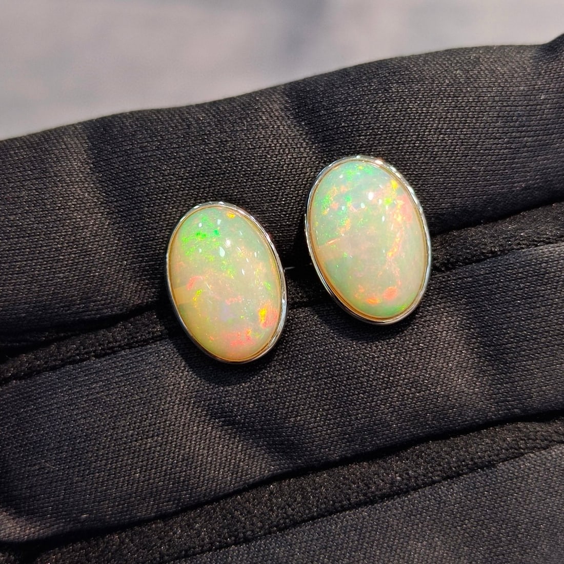 14k Gold 5.39 Ct Natural Opal Earrings: Ref:230940171 // gold content:14k gold // main gemstone:opal // shape:oval // carat weight:5. 39ct // color:white // treatment:natural // Condition: NewLow Estimate: 2400.00High Estimate: 3600.00