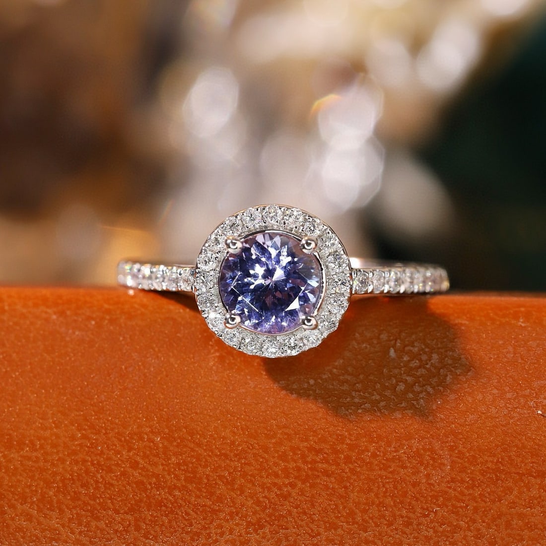14k Gold 1.10 Ctw Natural Tanzanite & Diamond Ring: Ref:230940208 // gold content:14k gold // ring size:7. 25us // // main gemstone:tanzanite // shape:round // carat weight:0. 85ct // color:purple // treatment:natural // cut grade:g // // adjacent