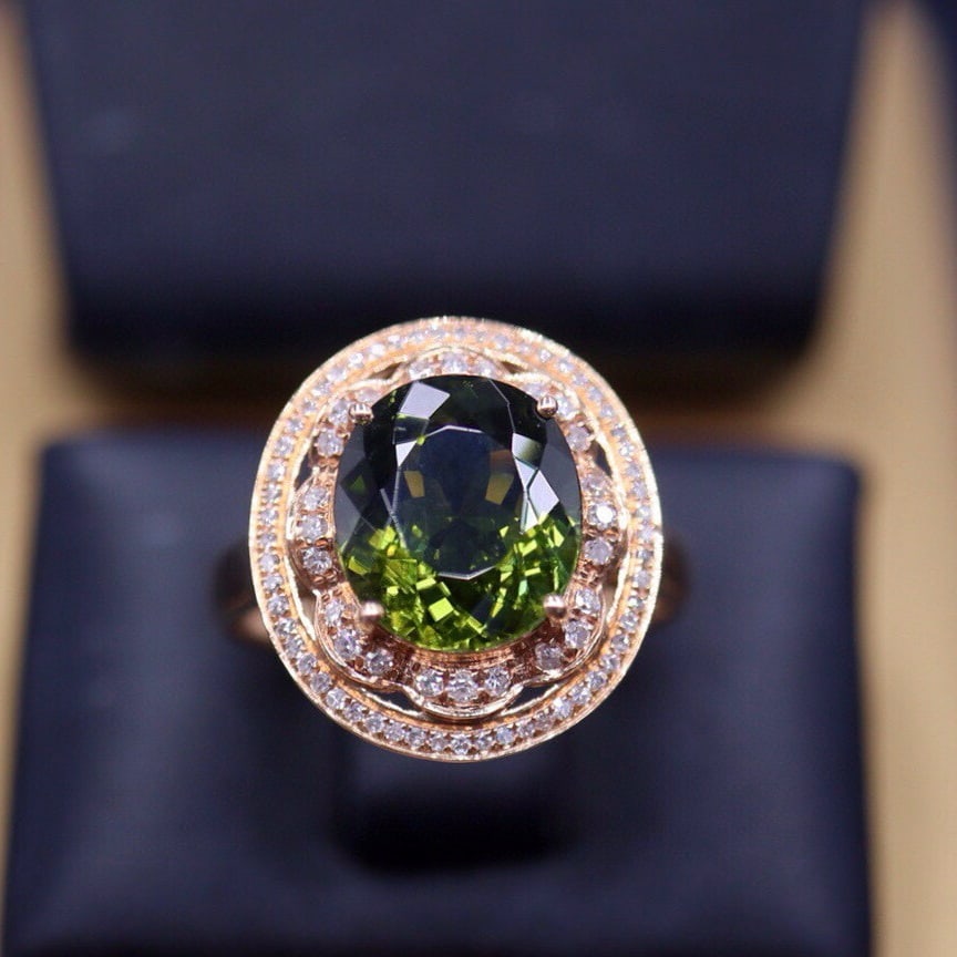 14k Gold 3.05 Ct Natural Tourmaline & Diamond Ring: Ref:230940214 // gold content:14k gold // ring size:7. 25us // // main gemstone:tourmaline // shape:oval // carat weight:3. 05ct // color:green // treatment:natural // // adjacent gemstone 2 :