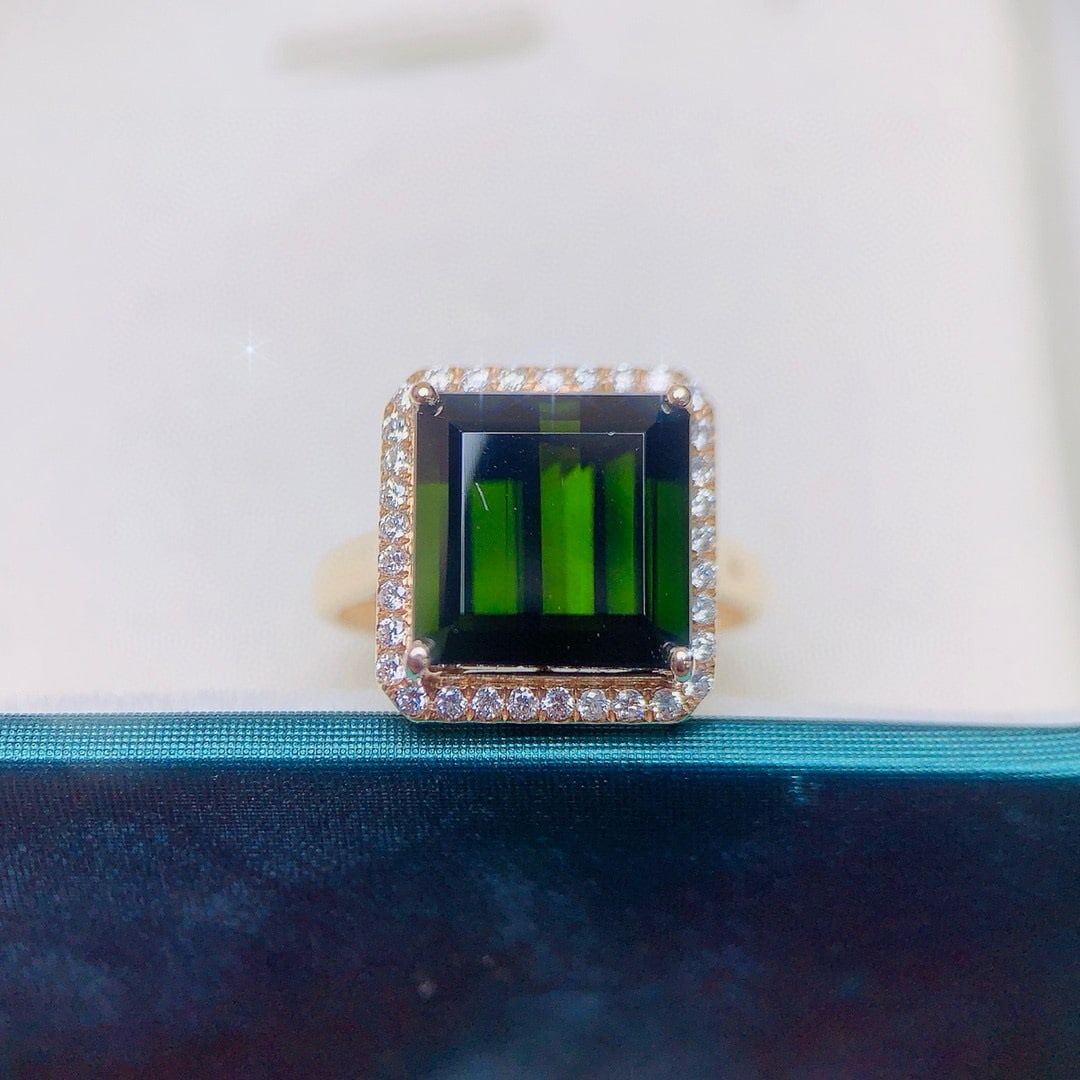 14k Gold 7.73 Ctw Natural Tourmaline & Diamond Ring: Ref:230940293 // gold content:14k gold // ring size:7. 25us // // main gemstone:tourmaline // shape:octagonal // carat weight:7. 4ct // color:green // treatment:natural // // adjacent gemstone 2 :