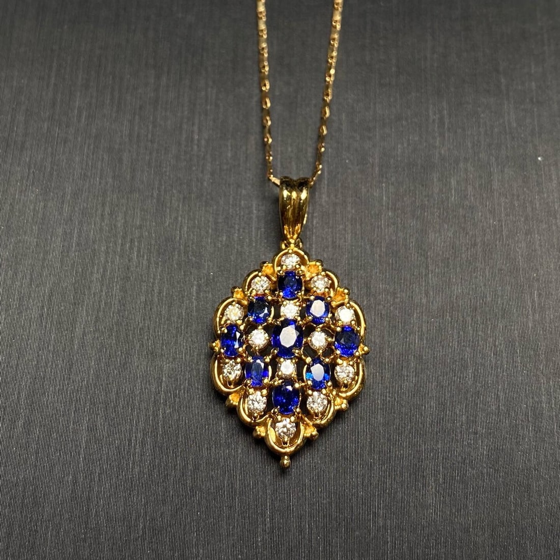 14k Gold 1.98 Ctw Vivid Blue Natural Sapphire & Diamond Pendant( Without Chain ): Ref:230940347 // gold content:14k gold // main gemstone:sapphire // shape:oval // carat weight:1. 50ct // color:vivid blue // treatment:natural // // adjacent gemstone 2 : diamond // shape:round //