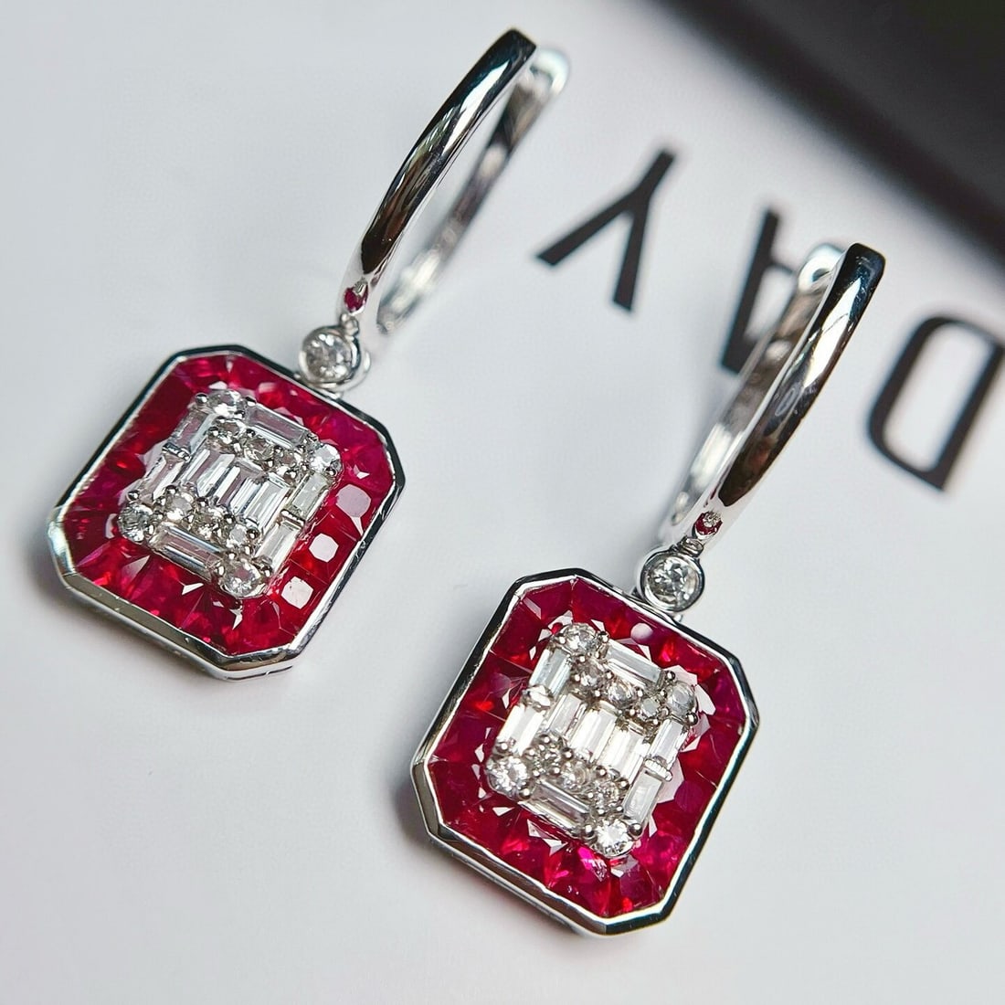 14k Gold 2.65 Ct Vivid Red Natural Ruby & Sapphire Earrings: Ref:230940400 // gold content:14k gold // main gemstone:ruby // shape:princess // carat weight:2. 65ct // color:vivid red // treatment:natural // // adjacent gemstone 2 : sapphire // number of stones: