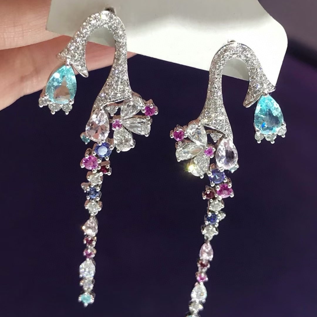14k Gold 3.38 Ctw Natural Paraiba Tourmaline & Diamond Earrings: Ref:230937015 // gold content:14k gold // main gemstone:paraiba tourmaline // shape:pear // carat weight:1. 04ct // color:blue // treatment:natural // // adjacent gemstone 2 : diamond // shape:multipl