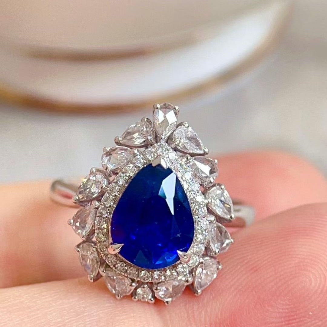 14k Gold 3.83 Ctw Natural Sapphire & Diamond Ring: Ref:230937148 // gold content:14k gold // ring size:7. 25us // // main gemstone:sapphire // shape:pear // carat weight:3. 04ct // color:royal blue // treatment:natural // // adjacent gemstone 2 :