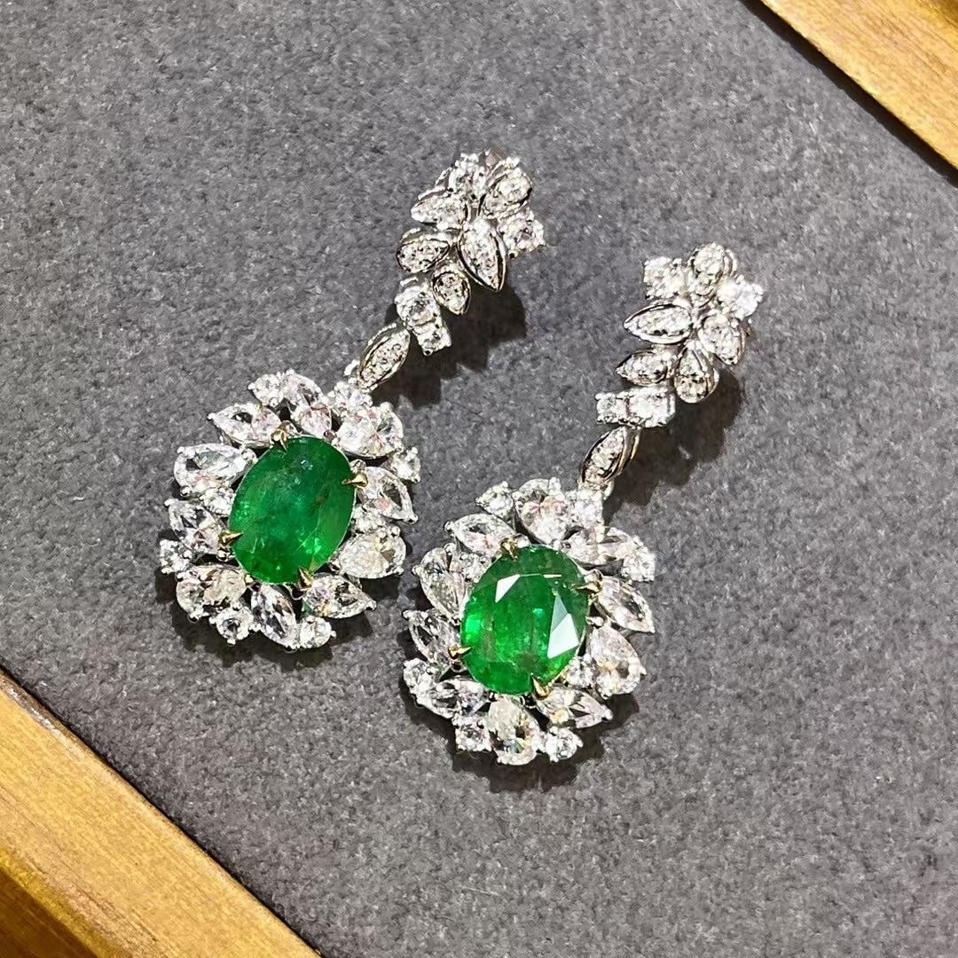 14k Gold 5.23 Ctw Vivid Green Natural Emerald & Sapphire Earrings: Ref:230937194 // gold content:14k gold // main gemstone:emerald // shape:oval // carat weight:2. 52ct // color:vivid green // treatment:natural // // adjacent gemstone 2 : sapphire //