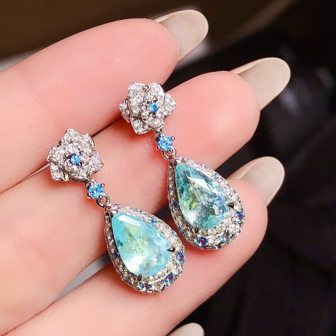 14k Gold 3.28 Ctw Natural Paraiba Tourmaline & Diamond Earrings: Ref:230937200 // gold content:14k gold // main gemstone:paraiba tourmaline // shape:pear // carat weight:2. 64ct // color:blue // treatment:natural // // adjacent gemstone 2 : diamond // shape:round /