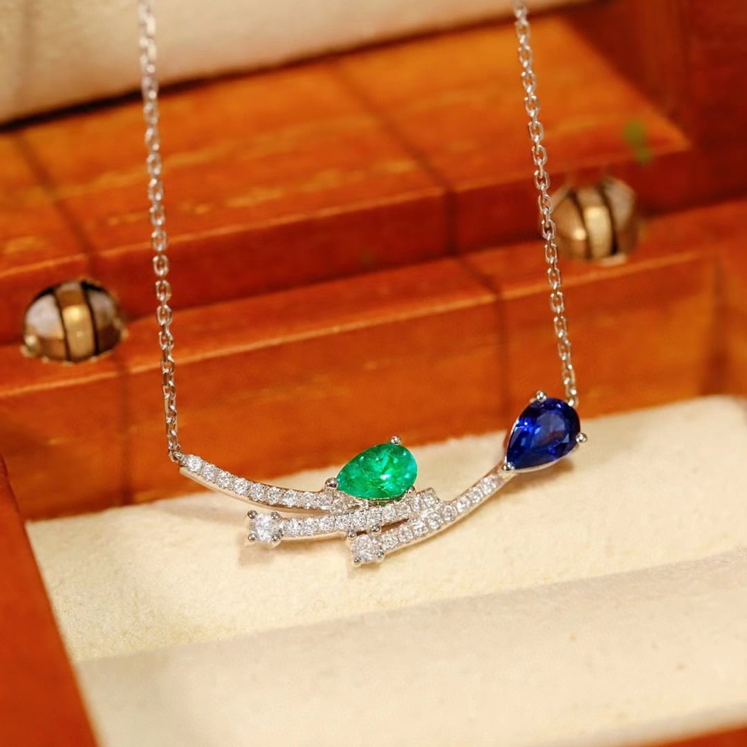 14k Gold 0.52 Ctw Natural Sapphire & Emerald & Toi Et Moi Necklace: Ref:230937202 // gold content:14k gold // main gemstone:sapphire // shape:pear // carat weight:0. 33ct // color:blue // treatment:natural // // adjacent gemstone 2 : emerald // shape:pear // carat