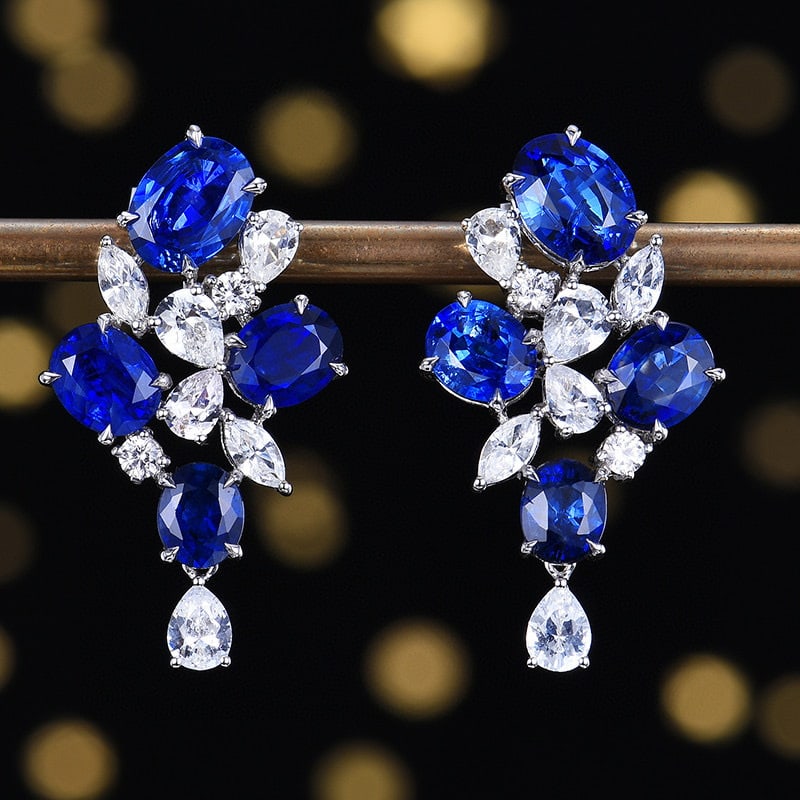 14k Gold 6.36 Ctw Natural Sapphire & Sapphire Earrings: Ref:230938002 // gold content:14k gold // main gemstone:sapphire // shape:oval // carat weight:4. 74ct // color:royal blue // treatment:natural // // adjacent gemstone 2 : sapphire // number of stones