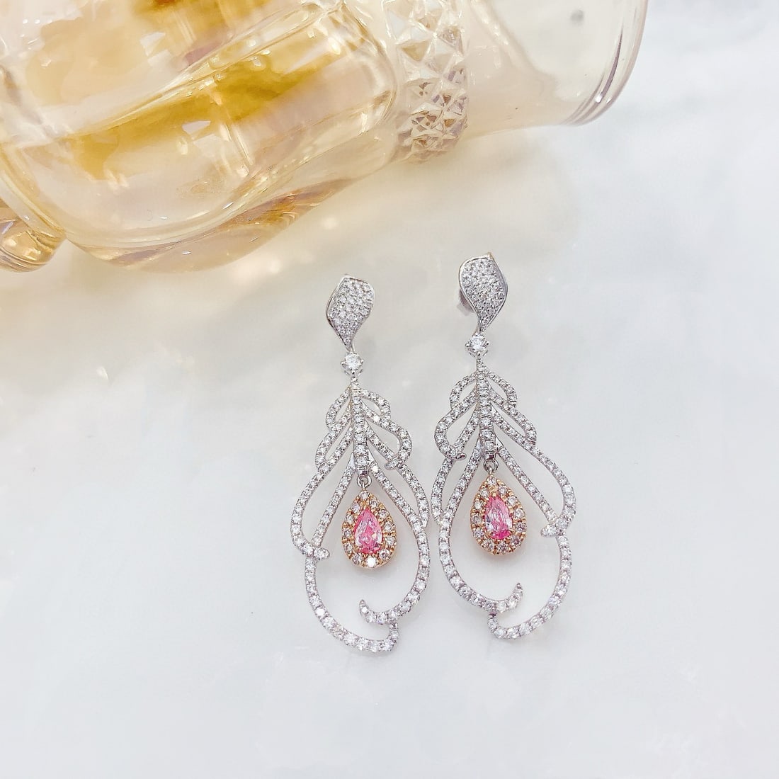 14k Gold 1.62 Ctw Natural Pink Diamond & Diamond Earrings: Ref:230938015 // gold content:14k gold // main gemstone:pink diamond // shape:pear // carat weight:0. 36ct // color:pink // treatment:natural // // adjacent gemstone 2 : diamond // shape:round //