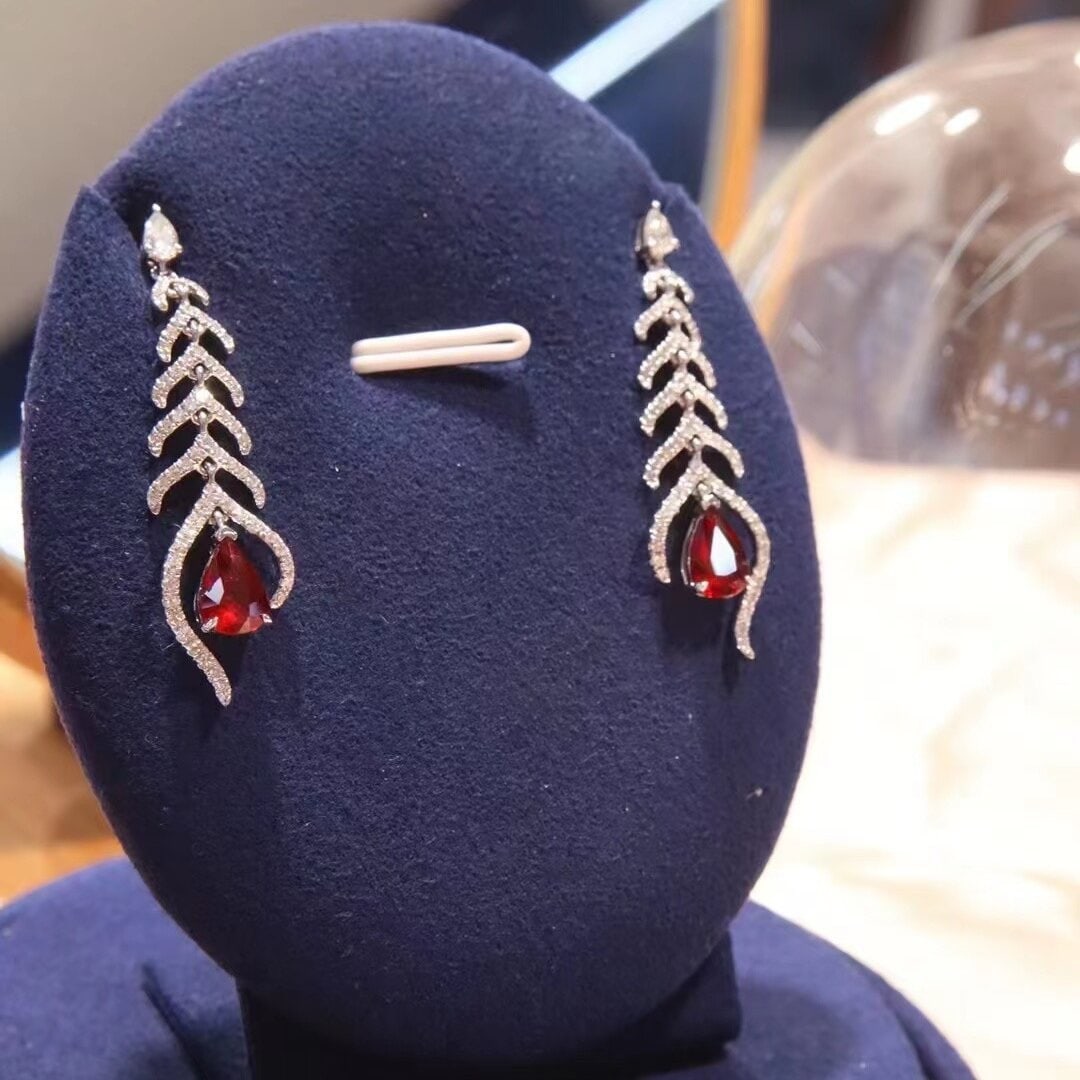 14k Gold 2.19 Ctw Vivid Red Natural Ruby & Diamond Earrings: Ref:230938044 // gold content:14k gold // main gemstone:ruby // shape:pear // carat weight:1. 48ct // color:vivid red // treatment:natural // // adjacent gemstone 2 : diamond // shape:multiply //