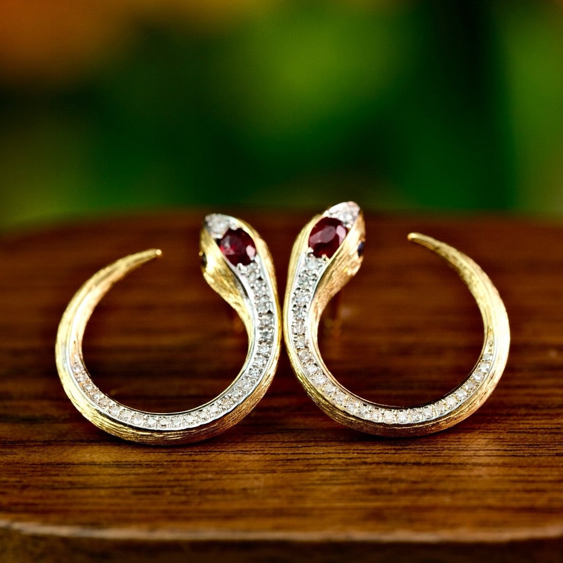 14k Gold 0.52 Ctw Natural Ruby & Diamond Earrings: Ref:230938050 // gold content:14k gold // main gemstone:ruby // shape:oval // carat weight:0. 24ct // color:red // treatment:natural // // adjacent gemstone 2 : diamond // shape:round // carat