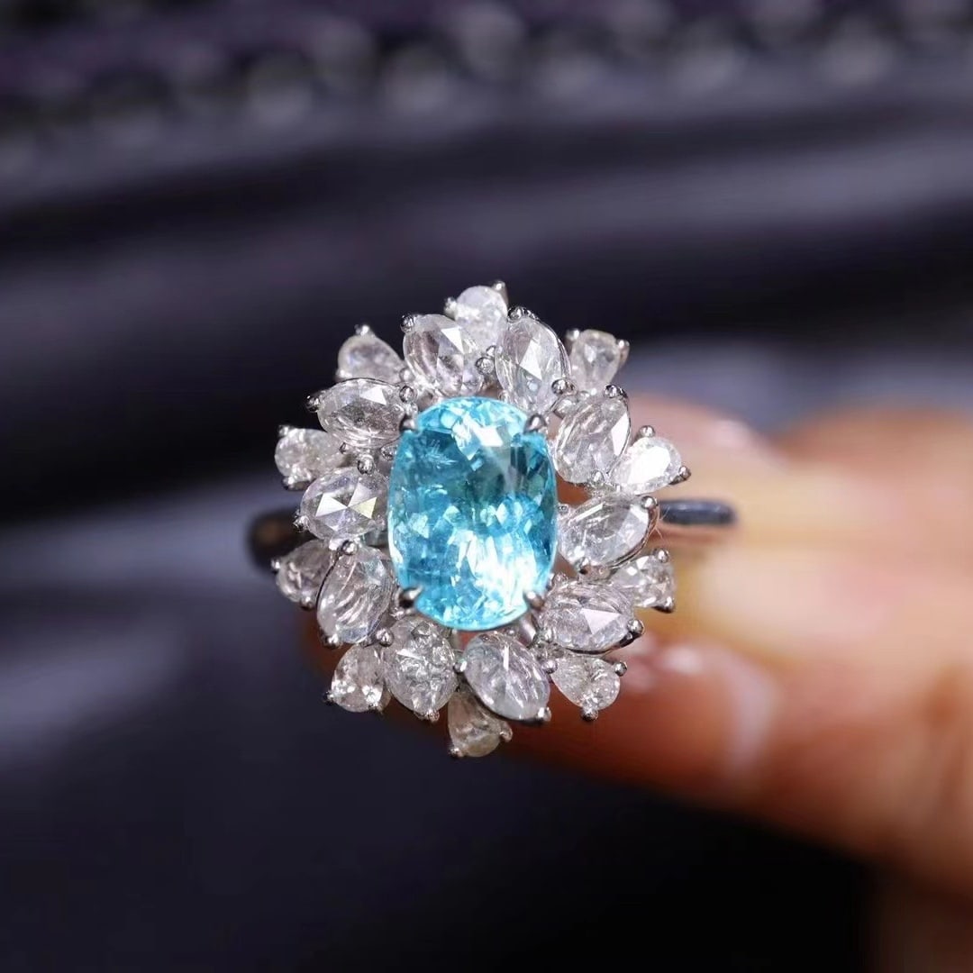 14k Gold 2.32 Ctw Natural Paraiba Tourmaline & Diamond Ring: Ref:230938055 // gold content:14k gold // ring size:7. 25us // // main gemstone:paraiba tourmaline // shape:oval // carat weight:1. 54ct // color:neon blue // treatment:natural // // adjacent