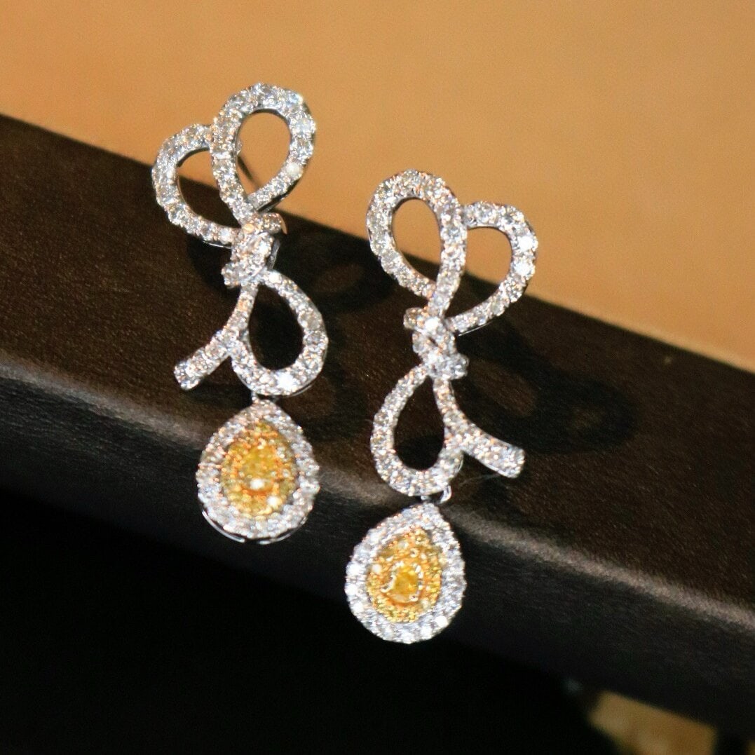14k Gold 1.3 Ct Natural Color Diamond Earrings: Ref:230938056 // gold content:14k gold // main gemstone:diamond // shape:multiply // carat weight:1. 3ct // clarity grade:vs-si // color:color // treatment:natural // Condition: NewLow Estimate: