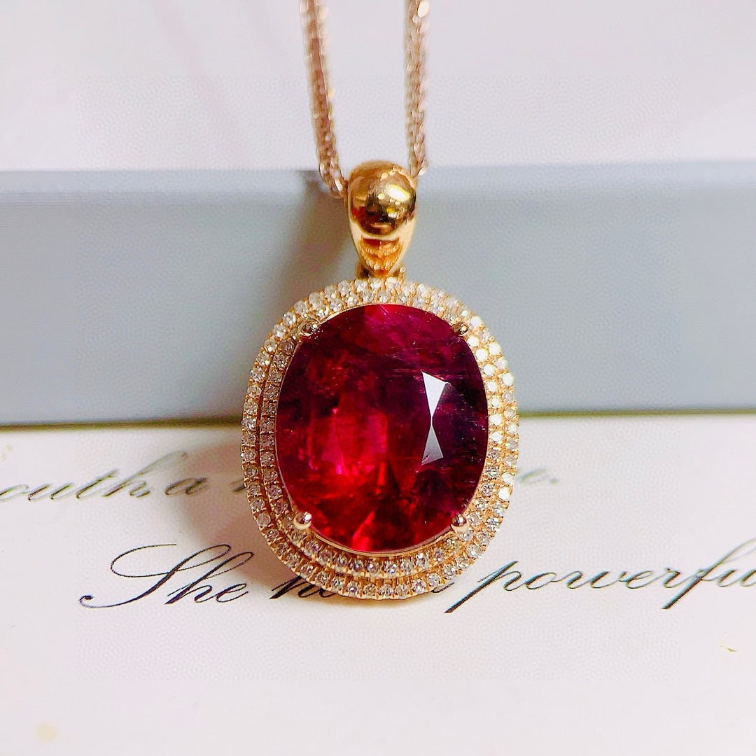 14k Gold 6.61 Ctw Natural Tourmaline & Diamond Pendant( Without Chain ): Ref:230938073 // gold content:14k gold // main gemstone:tourmaline // shape:oval // carat weight:6. 3ct // color:red // treatment:natural // // adjacent gemstone 2 : diamond // number of stones:104