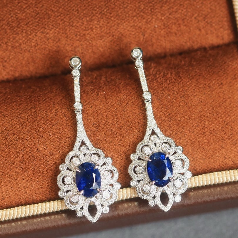 14k Gold 2.76 Ctw Natural Sapphire & Diamond Earrings: Ref:230938221 // gold content:14k gold // main gemstone:sapphire // shape:oval // carat weight:2. 03ct // color:royal blue // treatment:natural // // adjacent gemstone 2 : diamond // shape:round //
