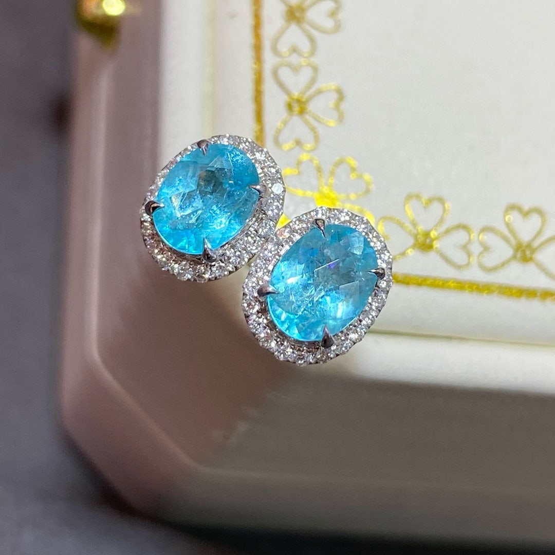 14k Gold 1.30 Ctw Natural Paraiba Tourmaline & Diamond Earrings: Ref:230938271 // gold content:14k gold // main gemstone:paraiba tourmaline // shape:oval // carat weight:0. 95ct // color:neon blue // treatment:natural // // adjacent gemstone 2 : diamond // shape:ro