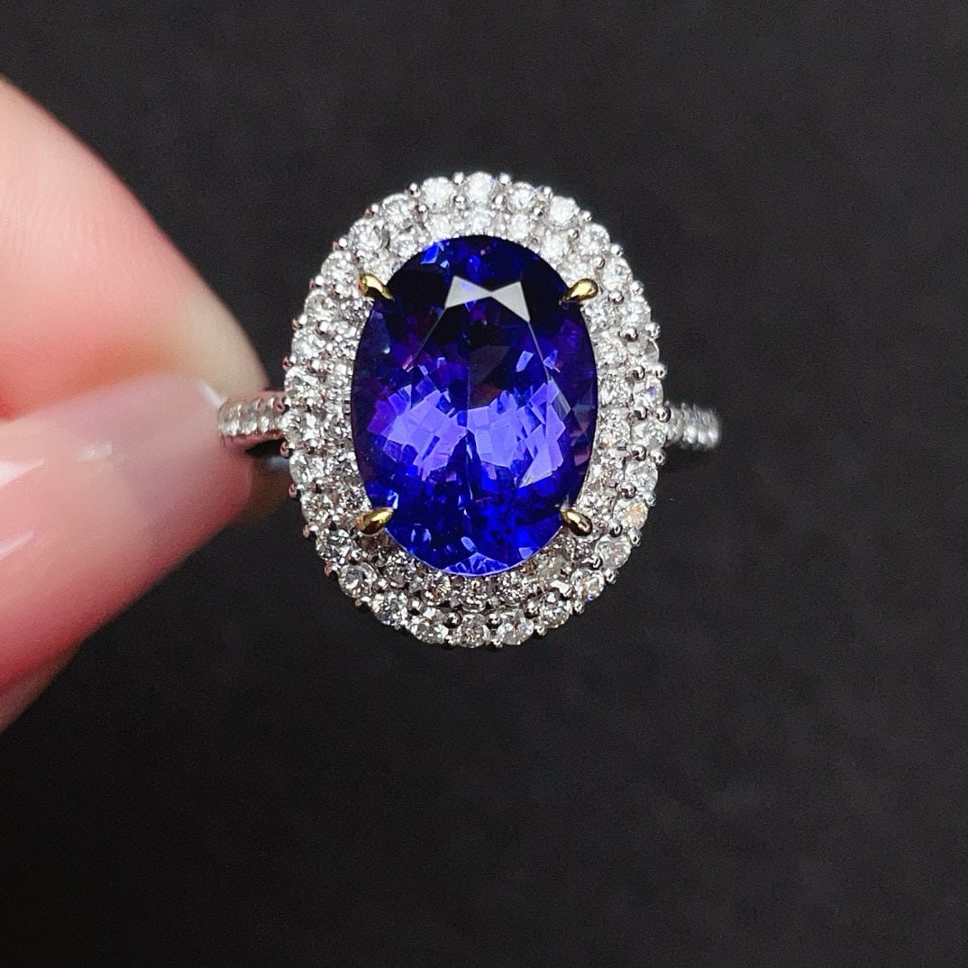 14k Gold 6.24 Ctw Natural Tanzanite & Diamond Ring: Ref:230938292 // gold content:14k gold // ring size:7. 25us // // main gemstone:tanzanite // shape:oval // carat weight:5. 05ct // color:blue // treatment:natural // // adjacent gemstone 2 :
