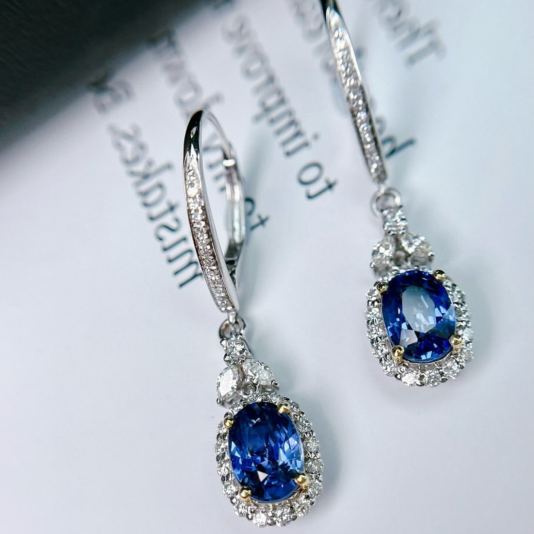 14k Gold 2.35 Ct Natural Sapphire & Diamond Earrings: Ref:230938299 // gold content:14k gold // main gemstone:sapphire // shape:oval // carat weight:2. 35ct // color:blue // treatment:natural // // adjacent gemstone 2 : diamond // number of stones:66
