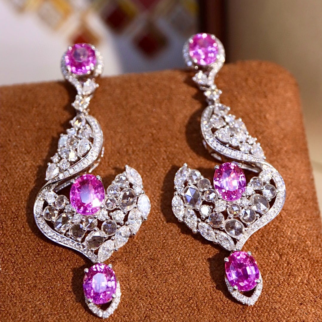14k Gold 7.48 Ctw Natural Padparadscha Sapphire & Diamond Earrings: Ref:230977014 // gold content:14k gold // main gemstone:padparadscha sapphire // shape:oval // carat weight:4. 92ct // color:pink // treatment:natural // // adjacent gemstone 2 : diamond // shape:mult