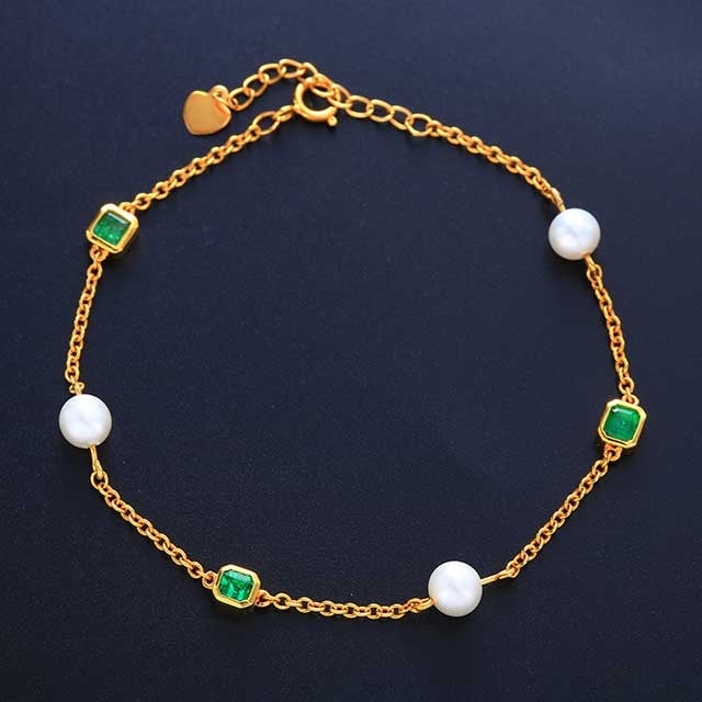14k Gold 3.47 Ctw Vivid Green Natural Emerald & Pearl Bracelet: Ref:230978015 // gold content:14k gold // main gemstone:emerald // shape:octagonal // carat weight:0. 6ct // color:vivid green // treatment:natural // // adjacent gemstone 2 : pearl // number of stone