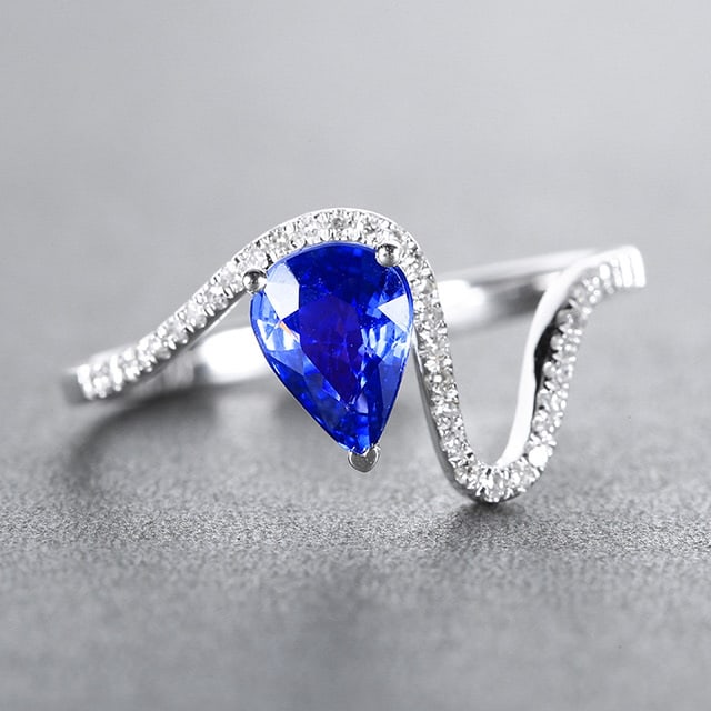 14k Gold 1.01 Ctw Natural Sapphire & Diamond Ring: Ref:230978045 // gold content:14k gold // ring size:7. 25us // // main gemstone:sapphire // shape:pear // carat weight:0. 90ct // color:blue // treatment:natural // // adjacent gemstone 2 :