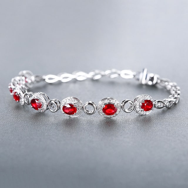 14k Gold 3.00 Ctw Natural Ruby & Diamond Bracelet: Ref:230978196 // gold content:14k gold // main gemstone:ruby // shape:oval // carat weight:2. 62ct // color:pigeonblood red // treatment:natural // // adjacent gemstone 2 : diamond // number of