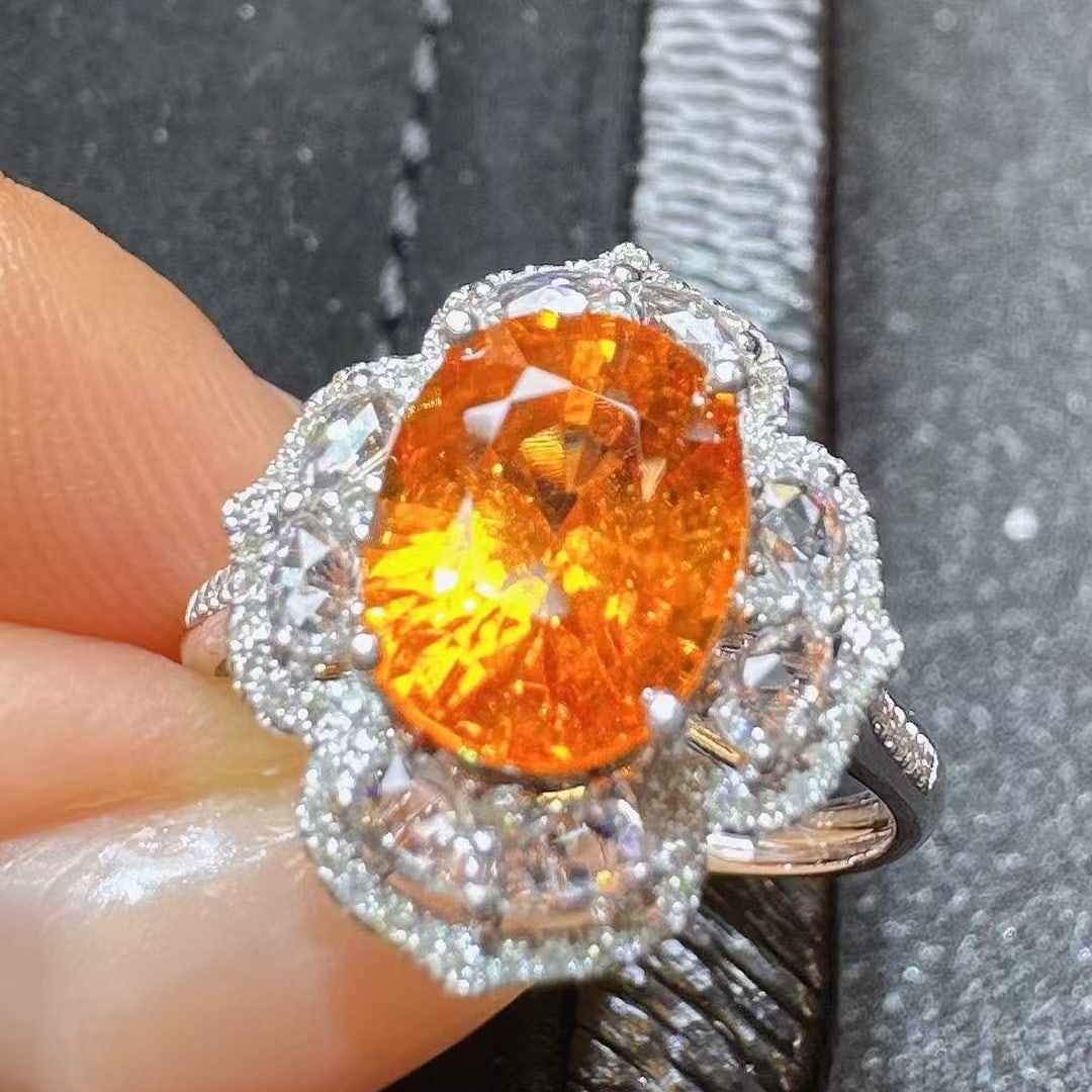 14k Gold 3.30 Ctw Natural Spessartine & Diamond Ring: Ref:230978408 // gold content:14k gold // ring size:7. 25us // // main gemstone:spessartine // shape:oval // carat weight:3. 06ct // color:orange // treatment:natural // // adjacent gemstone 2 :