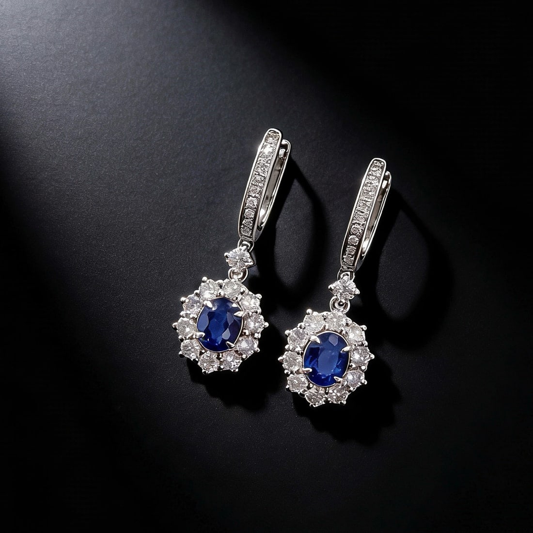18k Gold 1.70 Ctw Vivid Blue Natural Sapphire & Diamond Earrings: Ref:231125006 // gold content:18k gold // main gemstone:sapphire // shape:oval // carat weight:0. 90ct // color:vivid blue // treatment:natural // // adjacent gemstone 2 : diamond // shape:round //