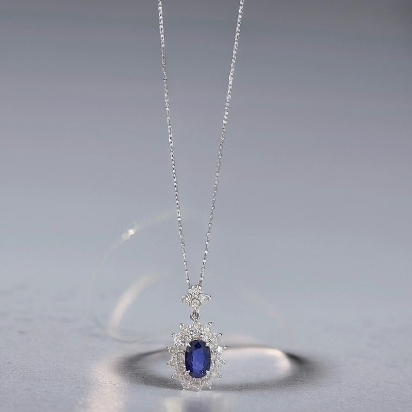 18k Gold 1.19 Ctw Natural Sapphire & Diamond Necklace: Ref:231125090 // gold content:18k gold // main gemstone:sapphire // shape:oval // carat weight:0. 65ct // color:blue // treatment:natural // // adjacent gemstone 2 : diamond // shape:round // carat we