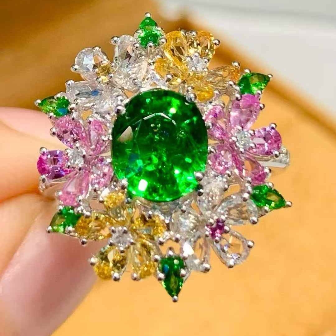 14k Gold 2.01 Ct Vivid Green Natural Tsavorite & Diamond Ring: Ref:231125237 // gold content:14k gold // ring size:7. 25us // // main gemstone:tsavorite // shape:oval // carat weight:2. 01ct // color:vivid green // treatment:natural // // adjacent gemstone 2 : di