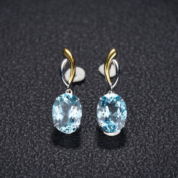 14k Gold 5.8 Ct Natural Aquamarine Earrings: Ref:231126016 // gold content:14k gold // main gemstone:aquamarine // shape:oval // carat weight:5. 8ct // color:santa maria color // treatment:natural // High Estimate: 6400Condition: NewLow