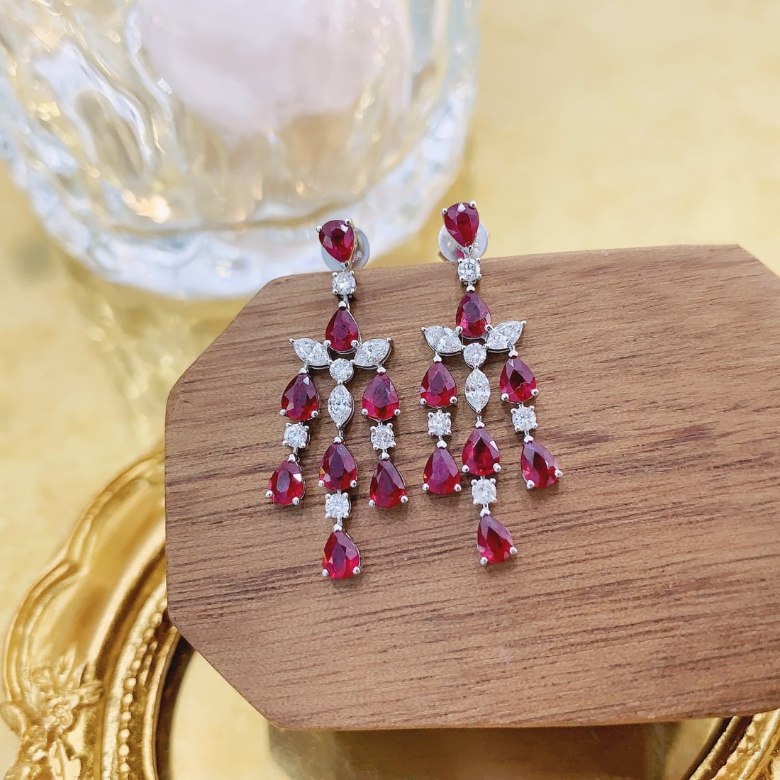 14k Gold 3.38 Ctw Natural Ruby & Diamond Earrings: Ref:231126025 // gold content:14k gold // main gemstone:ruby // shape:pear // carat weight:2. 72ct // color:red // treatment:natural // // adjacent gemstone 2 : diamond // shape:multiple // carat weig