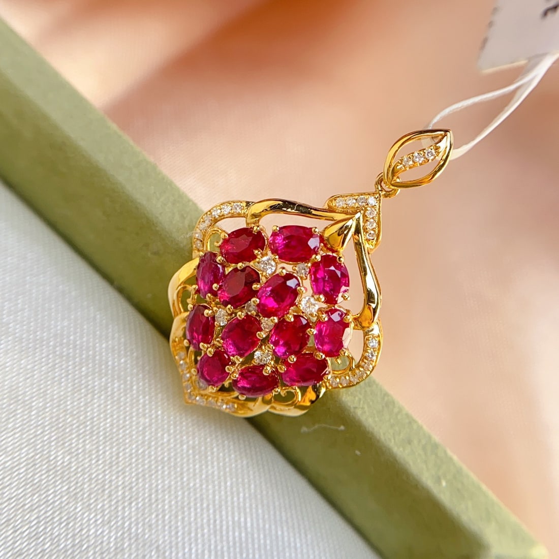 14k Gold 3.10 Ct Natural Ruby & Diamond Pendant( Without Chain ): Ref:231126076 // gold content:14k gold // main gemstone:ruby // shape:oval // carat weight:3. 10ct // color:red // treatment:natural // // adjacent gemstone 2 : diamond // number of stones:41 // shape