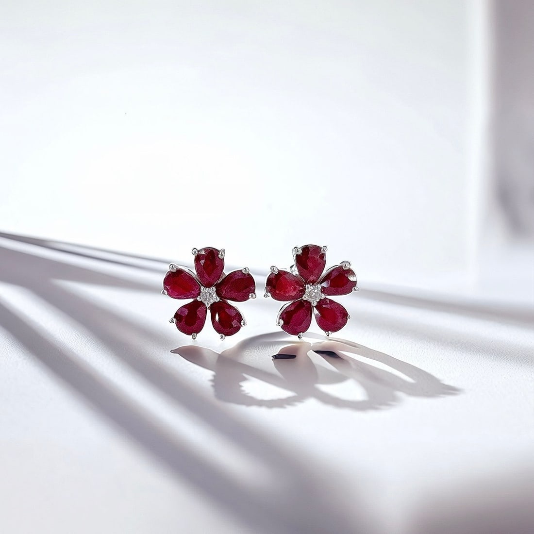 14k Gold 1.92 Ct Natural Ruby & Diamond Earrings: Ref:231126148 // gold content:14k gold // main gemstone:ruby // shape:pear // carat weight:1. 92ct // color:red // treatment:natural // // adjacent gemstone 2 : diamond // shape:round // clarity grade
