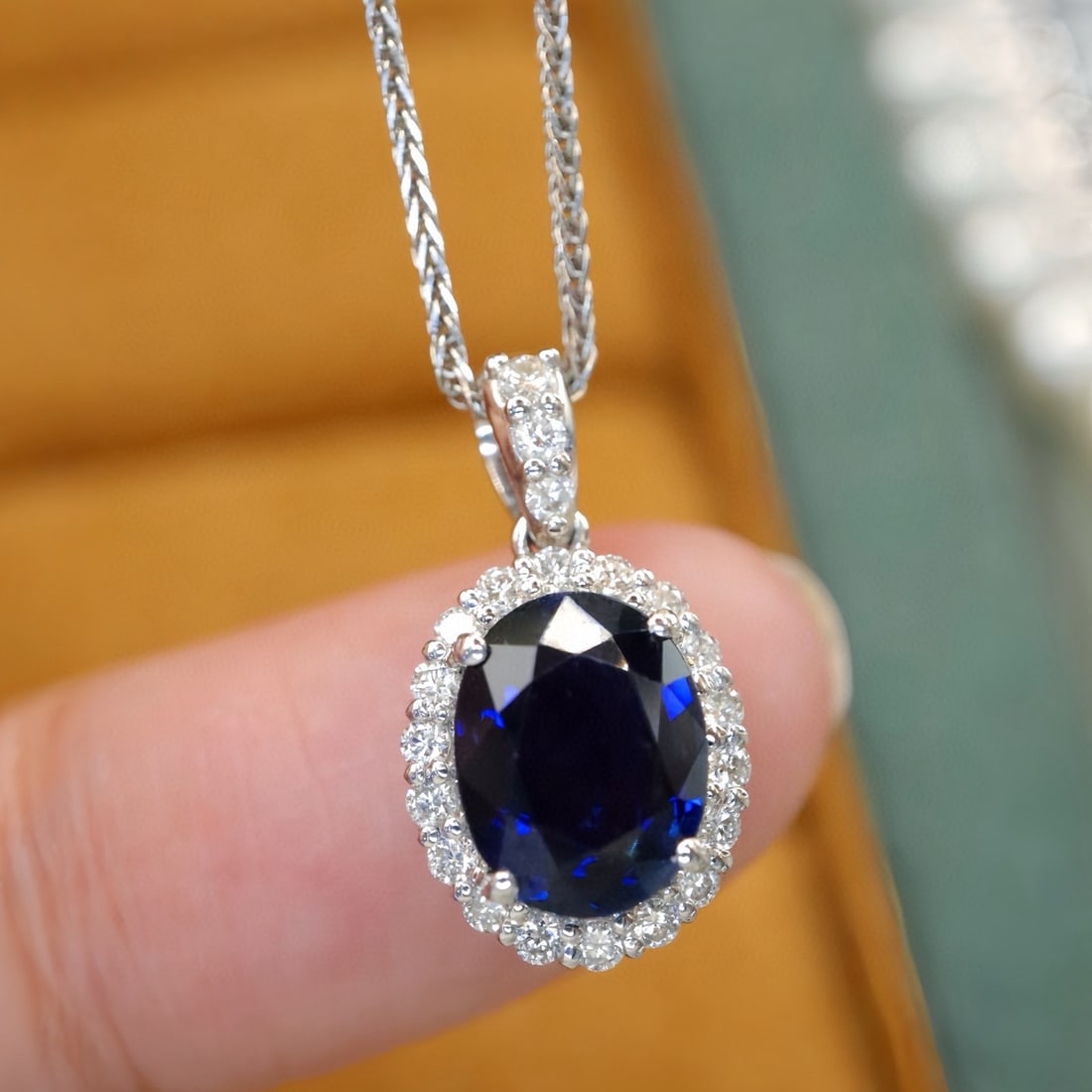 14k Gold 1.96 Ctw Natural Sapphire & Diamond Pendant( Without Chain ): Ref:231126219 // gold content:14k gold // main gemstone:sapphire // shape:oval // carat weight:1. 75ct // color:blue // treatment:natural // // adjacent gemstone 2 : diamond // number of stones:21 //