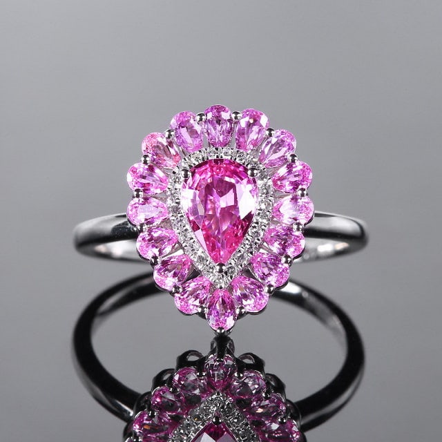 14k Gold 1.91 Ctw Natural Padparadscha Sapphire & Diamond Ring: Ref:231126247 // gold content:14k gold // ring size:7. 25us // // main gemstone:padparadscha sapphire // shape:pear // carat weight:1. 84ct // color:orangish pink // treatment:natural // // adjacent g