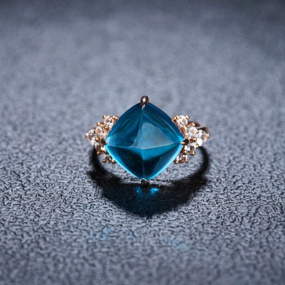 14k Gold 9.58 Ctw Natural Topaz & Sapphire Ring: Ref:231126266 // gold content:14k gold // ring size:7. 25us // // main gemstone:topaz // shape:sugar-loaf // carat weight:8. 95ct // color:blue // treatment:natural // // adjacent gemstone 2 : sapphir