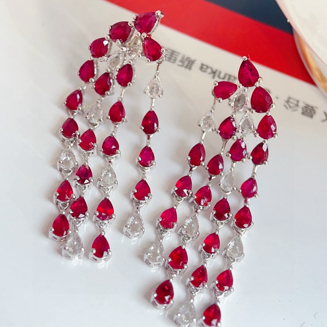 14k Gold 7.79 Ctw Natural Ruby & Sapphire Earrings: Ref:231126310 // gold content:14k gold // main gemstone:ruby // shape:pear // carat weight:6ct // color:red // treatment:natural // // adjacent gemstone 2 : sapphire // shape:pear // carat