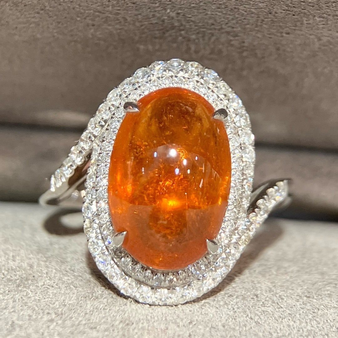 14k Gold 6.85 Ctw Natural Spessartine & Diamond Ring: Ref:231126327 // gold content:14k gold // ring size:7. 25us // // main gemstone:spessartine // shape:oval // carat weight:6. 33ct // color:orange // treatment:natural // // adjacent gemstone 2 : diamo