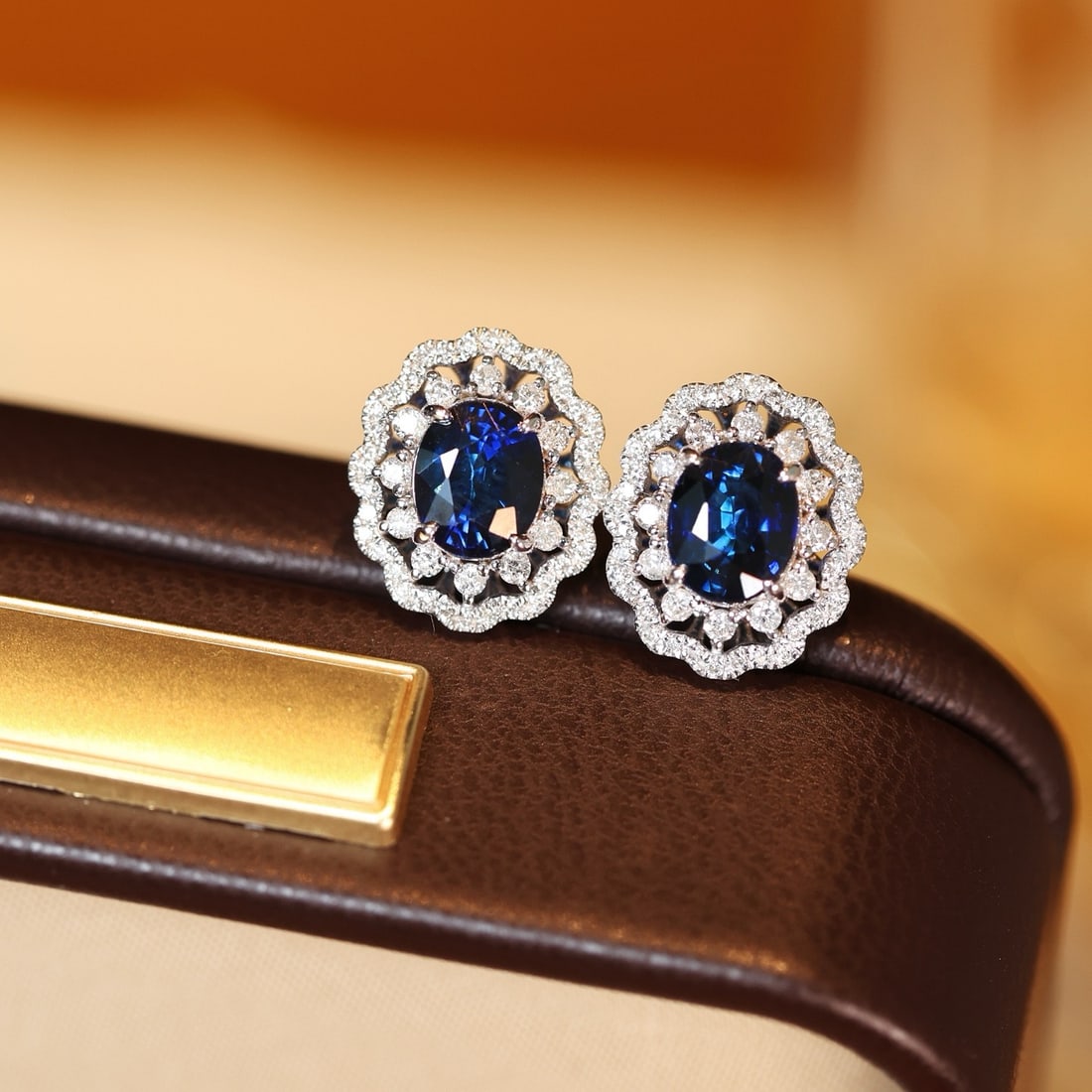 14k Gold 2.49 Ctw Natural Sapphire & Diamond Earrings: Ref:231126369 // gold content:14k gold // main gemstone:sapphire // shape:oval // carat weight:2. 03ct // color:blue // treatment:natural // // adjacent gemstone 2 : diamond // shape:round // carat