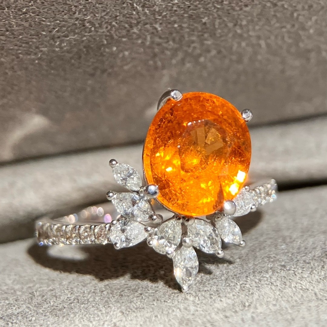 14k Gold 4.16 Ctw Natural Spessartine & Diamond Ring: Ref:231126379 // gold content:14k gold // ring size:7. 25us // // main gemstone:spessartine // shape:oval // carat weight:3. 52ct // color:orange // treatment:natural // // adjacent gemstone 2 : diamo