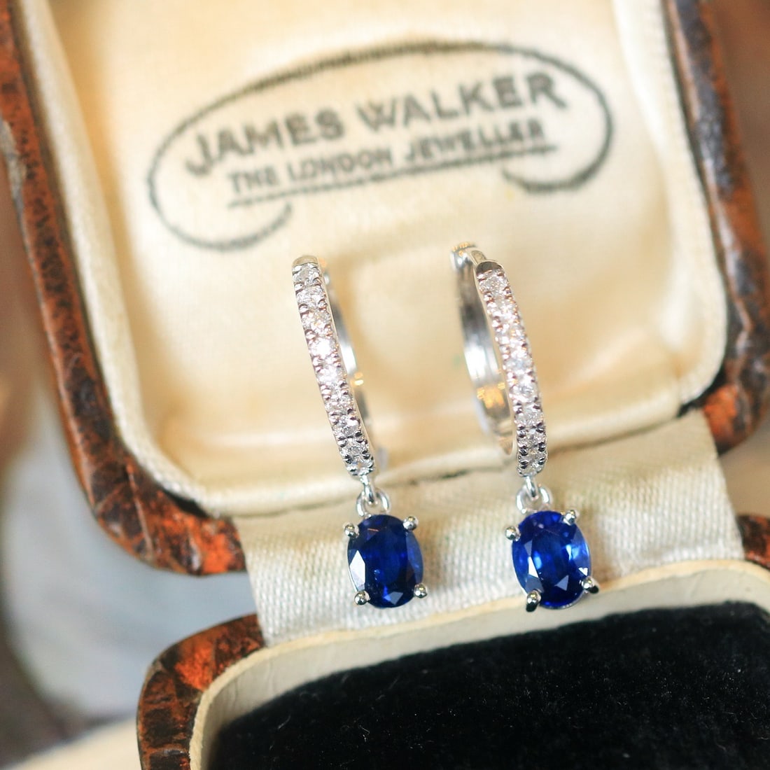 14k Gold 1.03 Ctw Natural Sapphire & Diamond Earrings: Ref:231126435 // gold content:14k gold // main gemstone:sapphire // shape:oval // carat weight:0. 85ct // color:blue // treatment:natural // // adjacent gemstone 2 : diamond // shape:round // carat we