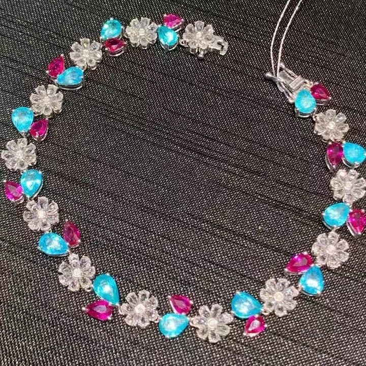 14k Gold 9.3 Ct Natural Paraiba Tourmaline & Ruby Bracelet: Ref:231139060 // gold content:14k gold // main gemstone:paraiba tourmaline & ruby // shape:pear // carat weight:9. 3ct // color:blue & red // treatment:natural // // adjacent gemstone 2 : sapphire //