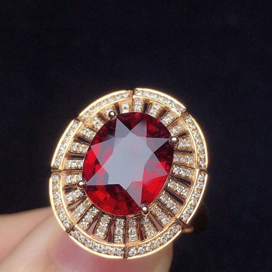 14k Gold 3.39 Ct Natural Tourmaline & Diamond Ring: Ref:231140338 // gold content:14k gold // ring size:7. 25us // // main gemstone:tourmaline // shape:oval // carat weight:3. 39ct // color:red // treatment:natural // // adjacent gemstone 2 : diamond /