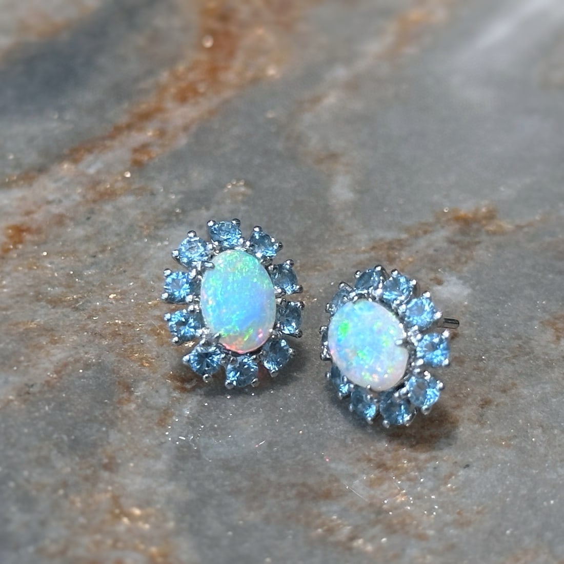 14k Gold 2 Ctw Natural Opal & Aquamarine Earrings: Ref:231143140 // gold content:14k gold // main gemstone:opal // shape:oval // carat weight:1ct // color:color // treatment:natural // // adjacent gemstone 2 : aquamarine // shape:round // carat weight
