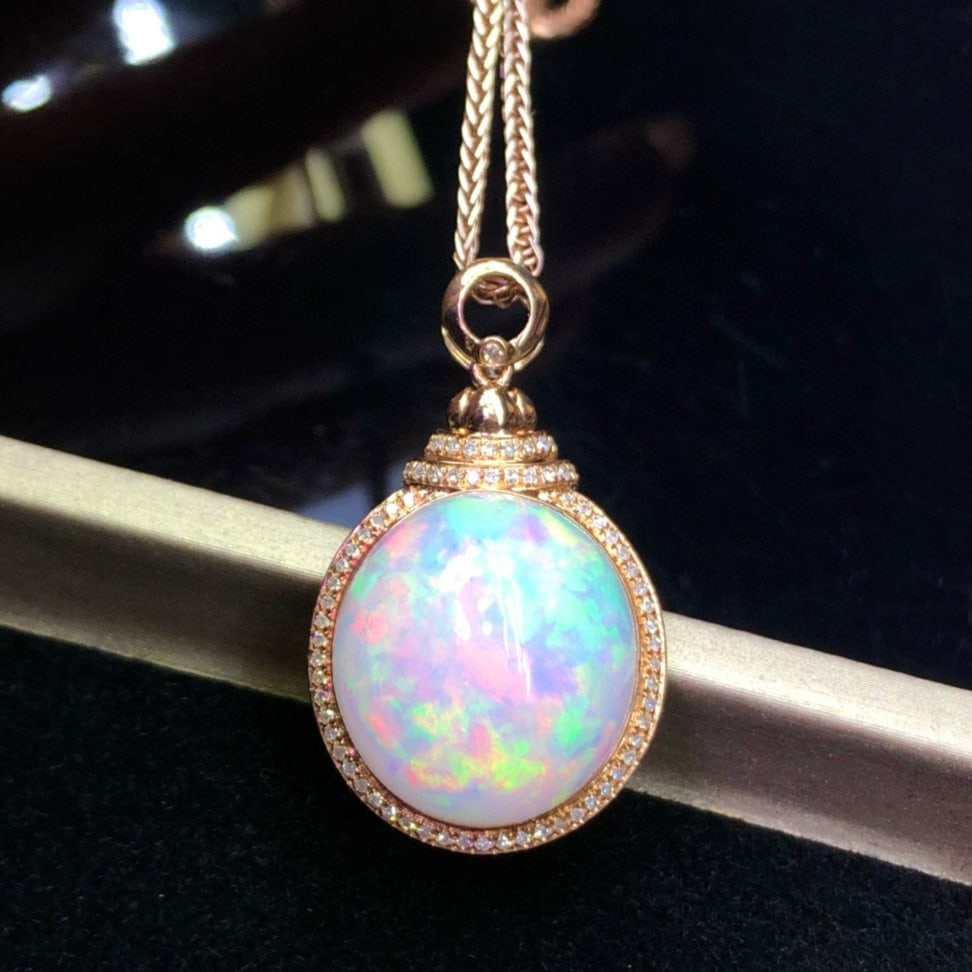 14k Gold 14.30 Ct Natural Opal & Diamond Pendant( Without Chain ): Ref:231143141 // gold content:14k gold // main gemstone:opal // shape:oval // carat weight:14. 30ct // color:color // treatment:natural // // adjacent gemstone 2 : diamond // number of stones:72 // sh