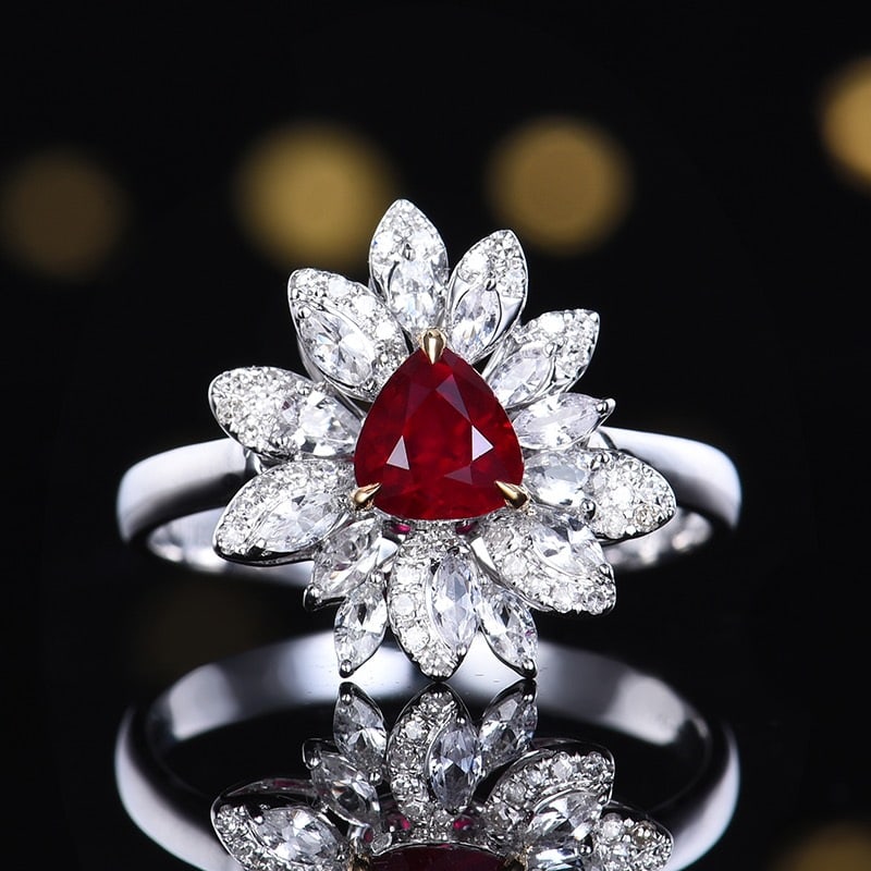 14k Gold 0.84 Ctw Natural Ruby & Diamond Ring: Ref:231144032 // gold content:14k gold // ring size:7. 25us // // main gemstone:ruby // shape:pear // carat weight:0. 74ct // color:red // treatment:natural // // adjacent gemstone 2 : diamond //