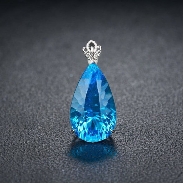 14k Gold 24.92 Ct Natural Topaz & Diamond Pendant( Without Chain ): Ref:231144243 // gold content:14k gold // main gemstone:topaz // shape:pear // carat weight:24. 92ct // color:blue // treatment:natural // // adjacent gemstone 2 : diamond // shape:round // clarity