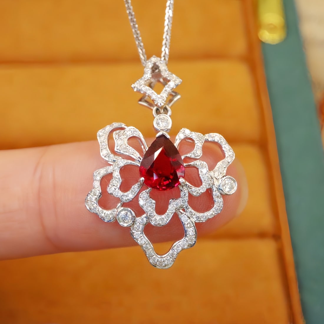14k Gold 1.54 Ctw Natural Ruby & Diamond Pendant( Without Chain ): Ref:231144343 // gold content:14k gold // main gemstone:ruby // shape:pear // carat weight:1. 16ct // color:red // treatment:natural // // adjacent gemstone 2 : diamond // number of stones:112 // shap