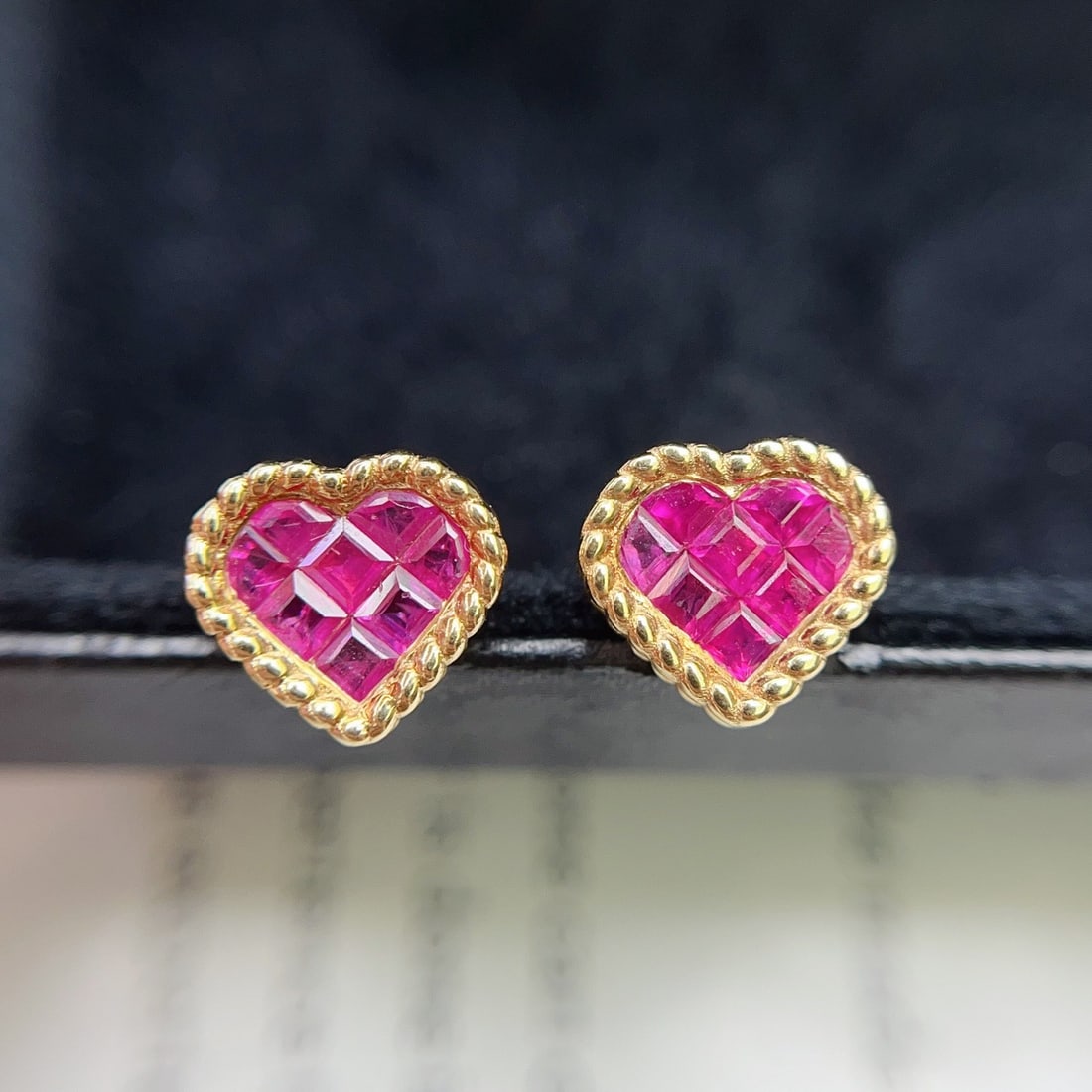 14k Gold 1.10 Ct Natural Ruby Earrings: Ref:231144359 // gold content:14k gold // main gemstone:ruby // shape:square // carat weight:1. 10ct // color:red // treatment:natural // Condition: NewLow Estimate: 3100High Estimate: 4600